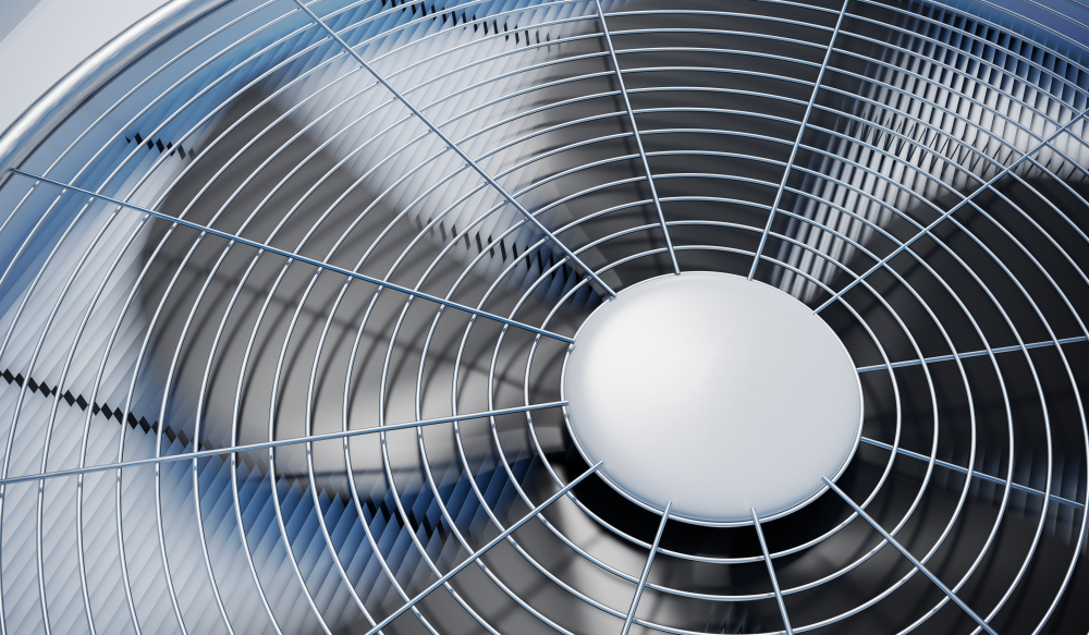 A close up of the top fan on an HVAC unit.